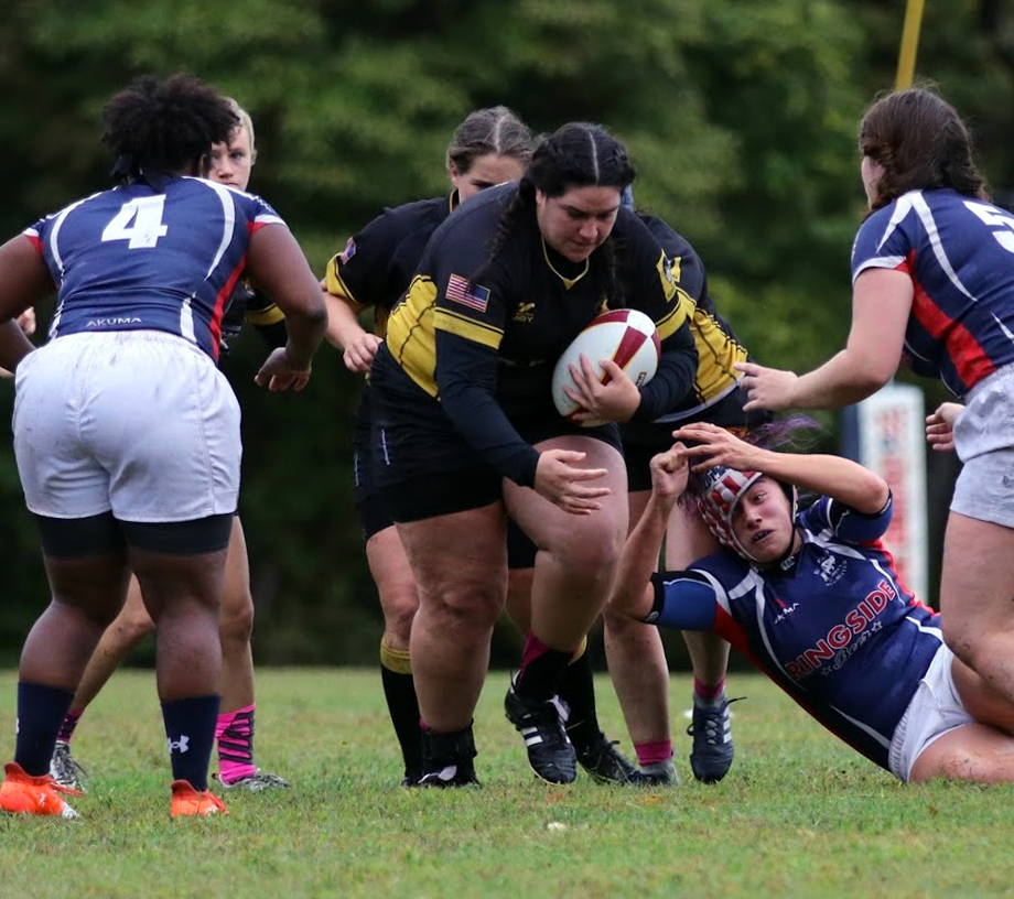 Ashley Chipps drags several defenders as she gains extra meters against Buffalo RFC